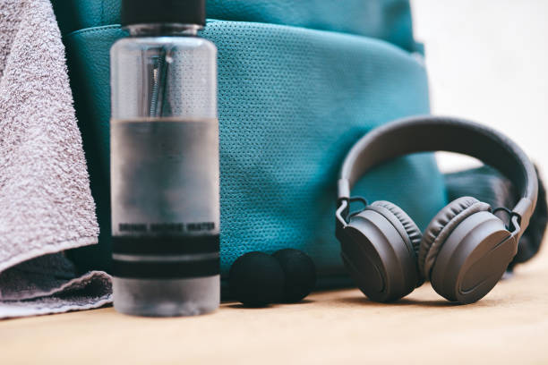 Gear up, its game time Shot of a sports bag and other items in an empty squash court tennis ball container stock pictures, royalty-free photos & images