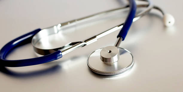 istock Medical stethoscope on gray background. 1231327286