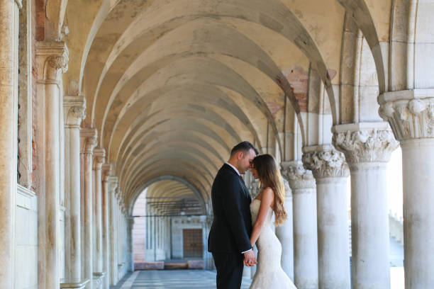 istock Groom and bride on a corridor 1231340762
