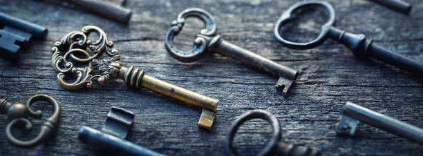 istock Pattern of vintage keys on a wooden background 1231398910