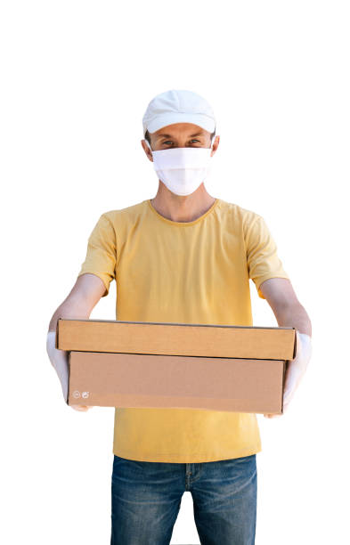 istock Man from delivery service in protective gloves holding box. 1231401434