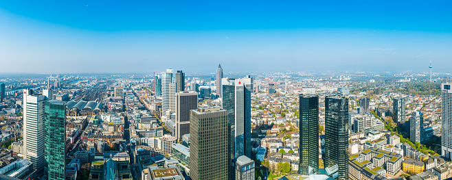 Aerial panorama over the downtown financial district skyscrapers of Frankfurt, Germany’s banking capital.