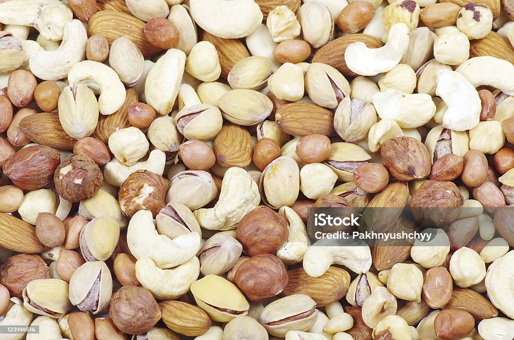 mixed nuts mixed nuts on a background Almond Stock Photo