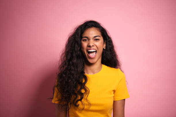 istock Young African woman  screaming in studio shot. 1231451071