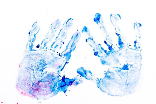 istock multicolored prints of children's hands on white background. Abstract painted background. Children's art and painting. 1231473119