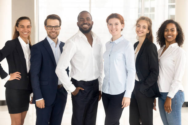 istock Happy diverse and multiracial employees group looking at camera. 1231521956