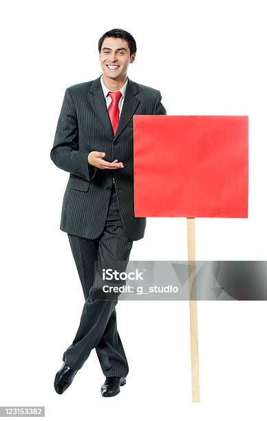 Hombre De Negocios Mostrando Aislado Rojo Signboard Foto de stock y más banco de imágenes de Adulto