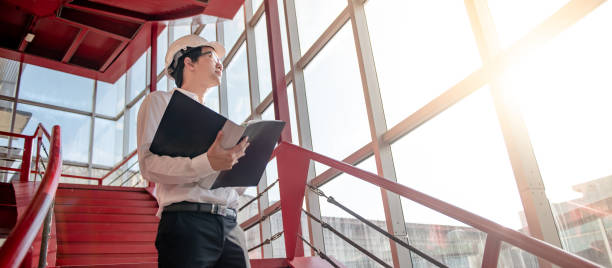 istock Asian civil engineer man working at construction site 1231538442