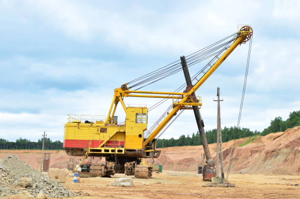 istock Huge mining excavator in the limestone open-pit. Biggest digger working in dolomite quarry. Largest tracked machine with electric shovel. Heavy duty electric-powered mining equipment 1231591275