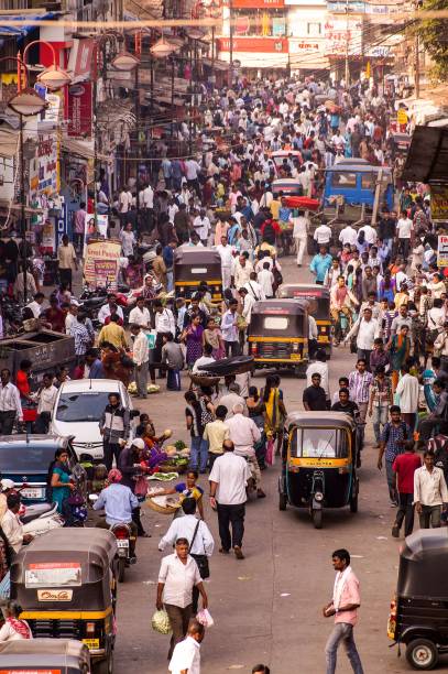 Crowded streets in Mumbai, India's largest city. Mumbai, India - April 2017: Mumbai is the centre of the Mumbai Metropolitan Region, the sixth most populous metropolitan area in the world with a population of over 23.64 million. india crowd stock pictures, royalty-free photos & images