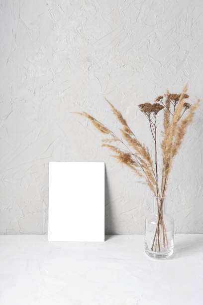 istock Mock-up greeting cards on gray next to dried flowers. 1231656629