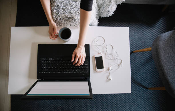 istock Working from home, typing on laptop keyboard, top view 1231664933