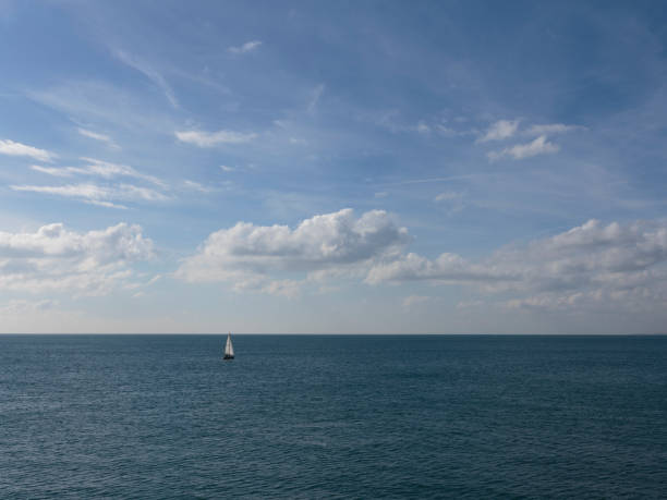 Sailing Yatch in the distance from Brighton Palace Pier, Brighton, England