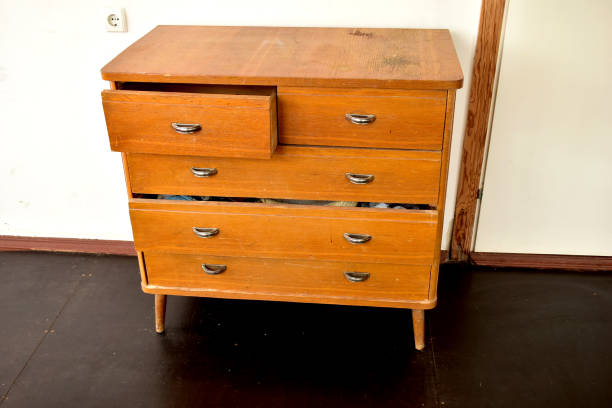 istock Old chest of drawers with shiny handles. 1231671692