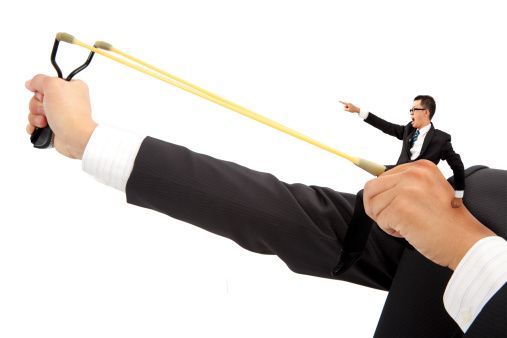 business motivate concept. businessman with slingshot and prelaunch