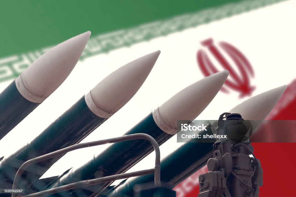 Cruise missiles on the background of the flag of Iran. The concept of a military conflict in the Persian Gulf. Cruise missiles on the background of the flag of Iran. The concept of a military conflict in the Persian Gulf. The threat of war. Iran Stock Photo