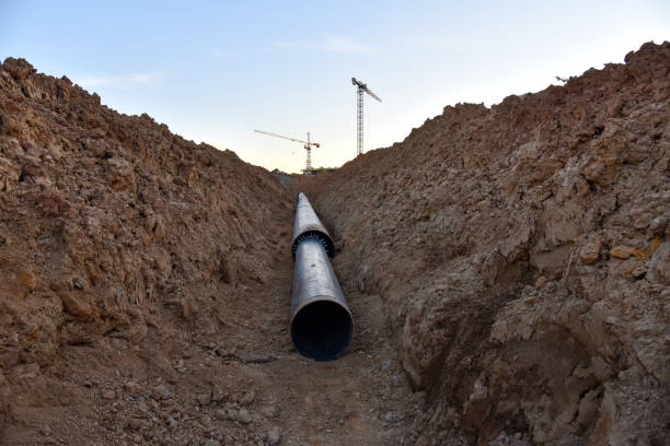 istock Sewer pipes for laying an external sewage system at a construction site. Sanitary drainage system for a multi-story building. Civil infrastructure pipe, water lines and storm sewers 1231742497