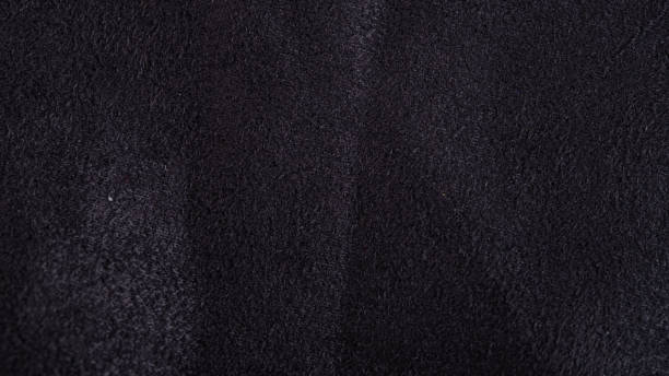 istock Close up of natural black suede leather background 1231754710
