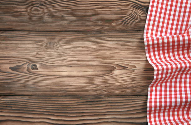 istock Red checkered picnic cloth on wooden background,food design tabletop,backdrop. 1231804106