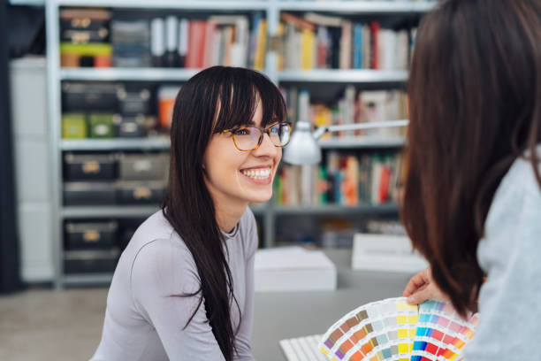 istock Happy young woman working in a design studio 1231805668