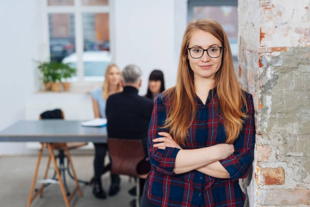 istock Confident young businesswoman with folded arms 1231810362