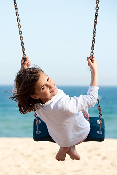 istock Little girl swinging 123181079