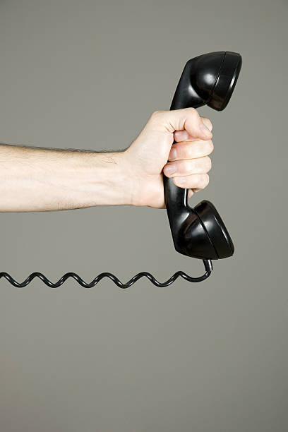 istock hand holding a telephone 123181463