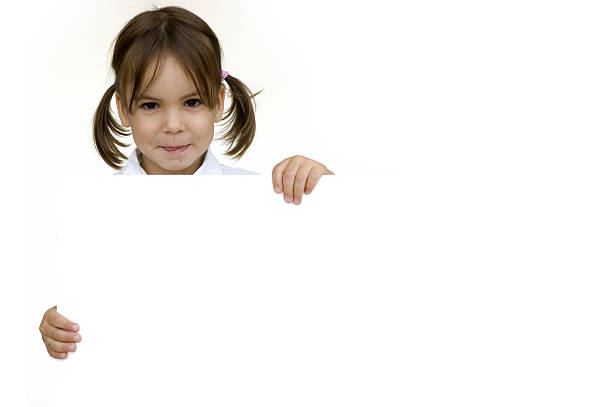 istock little girl holding a white banner 123182244
