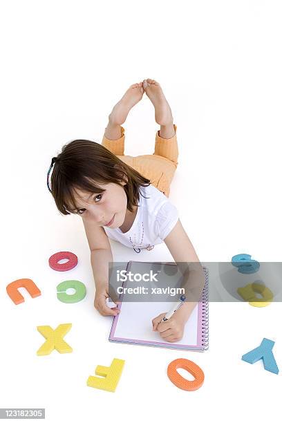 Young Girl Doing Her Homework Stock Photo - Download Image Now - Adolescence, Alphabet, Baby - Human Age