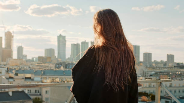 istock Young woman on a rooftop. Enjoying freedom 1231851625
