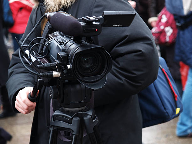 istock Cameraman getting video on busy street 123185511