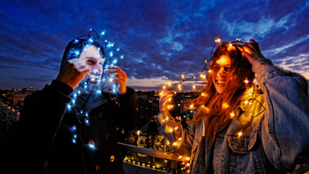 istock Night talks on the rooftop. Funny illumination. City after sunset 1231856312