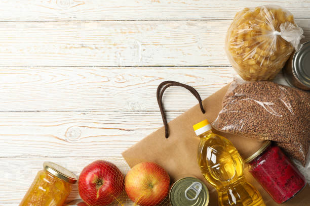 istock Different food on wooden background, top view. Donation concept 1231887511