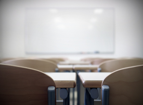 An empty classroom at a university, shallow depth-of-field. 
