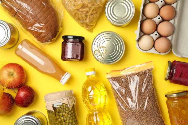 istock Different food on yellow background, top view. Donation concept 1231929494