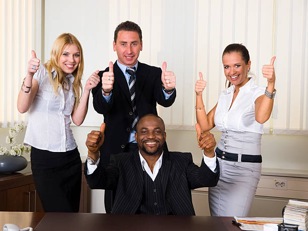 istock Afroamerican CEO and his team giving a thumbs up 123195044