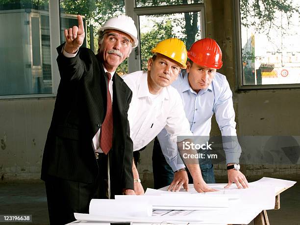 Engineer Inspects The Construction Site Stock Photo - Download Image Now - Adult, Adults Only, Architect