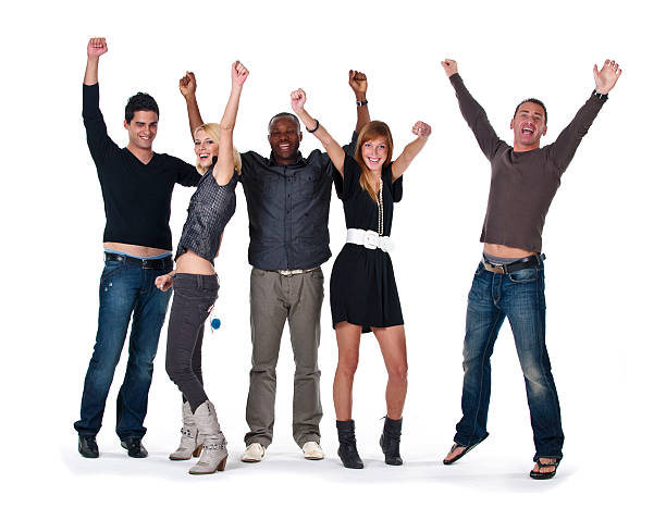 Happy jumping group raising hands  cheering group of people success looking at camera stock pictures, royalty-free photos & images