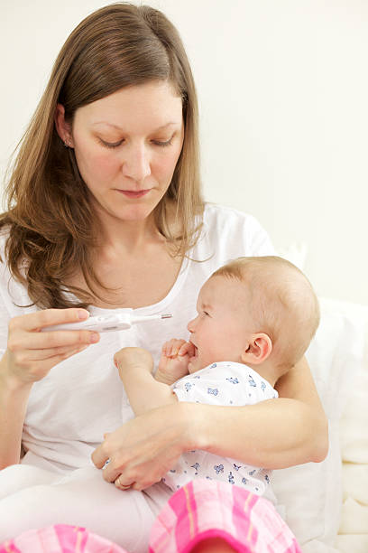 istock Woman with crying baby 123199156