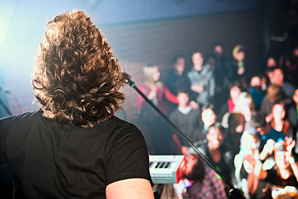istock View of thrilled audience over rock musician's shoulder 123200914
