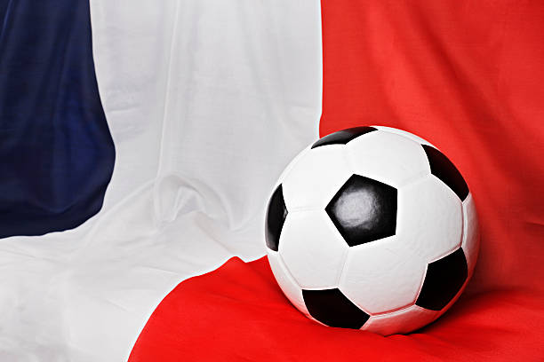 чемпионат футбол мяч находится на драпированной французский флаг - tricoleur стоковые фото и изображения