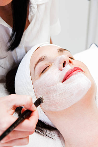 istock Beauty therapist paints facial mask 123201097