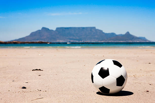 istock Soccer ball on beach in front of Table Mountain 123201382