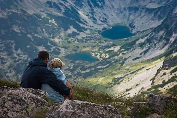 istock Young couple watching high mountain lakes 123203166