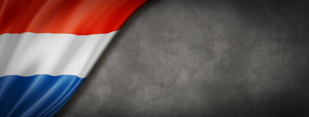istock Netherlands flag on concrete wall banner 1232039172