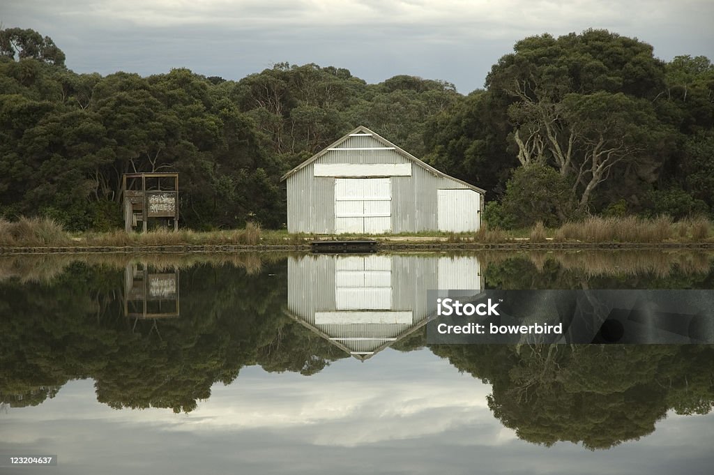 boat shed boat shed on a tranquil lake with beautiful reflection. anglesea, victoria, australia. Anglesea Stock Photo