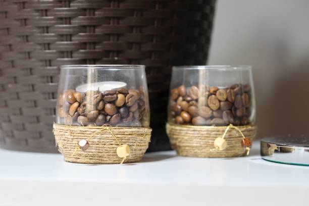 istock Candlesticks with coffee grains, decorated with brown rope glass candle holders 1232077577