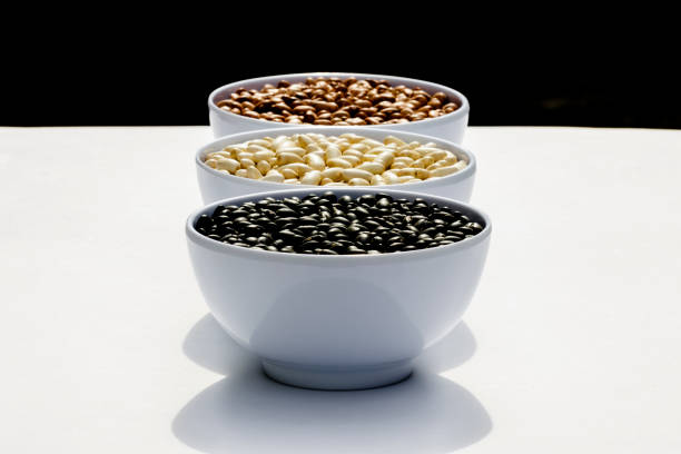 close-up in white bowl with white beans isolated