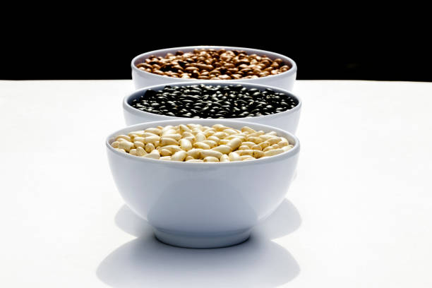 close-up in white bowl with white beans isolated