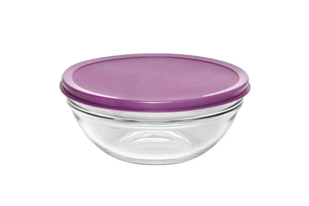 Round glass box container with plastic cover isolated on white background